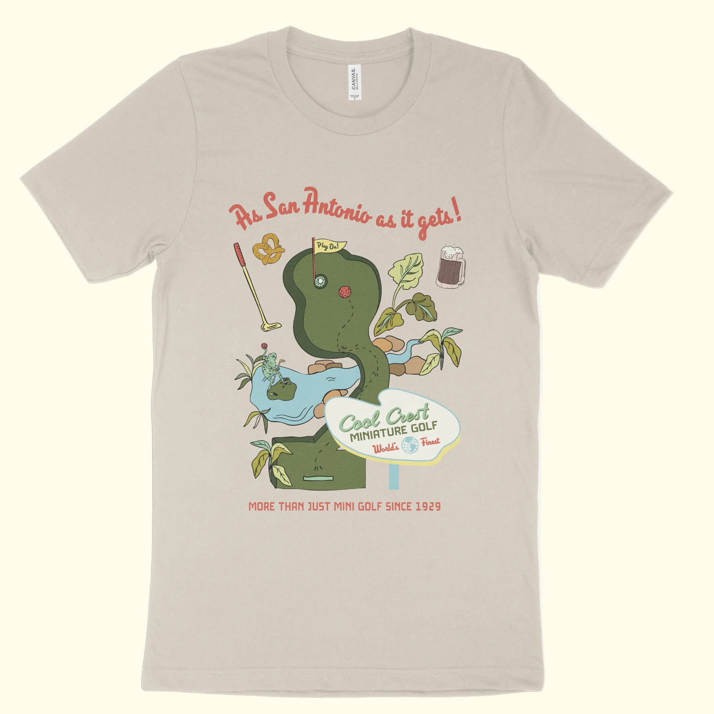 Beige t-shirt with a graphic of a snake and mini golf elements on a white background