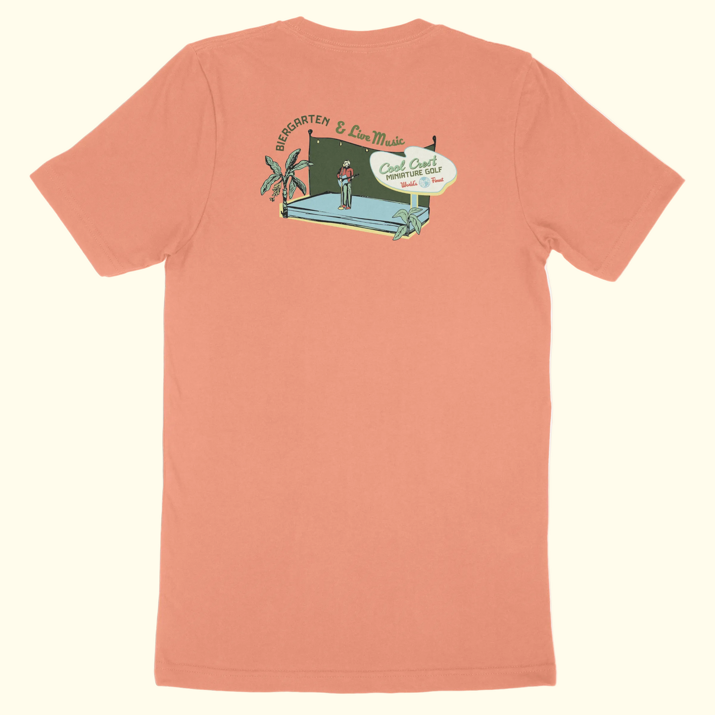 Peach-colored t-shirt with a graphic design on the back against a white background